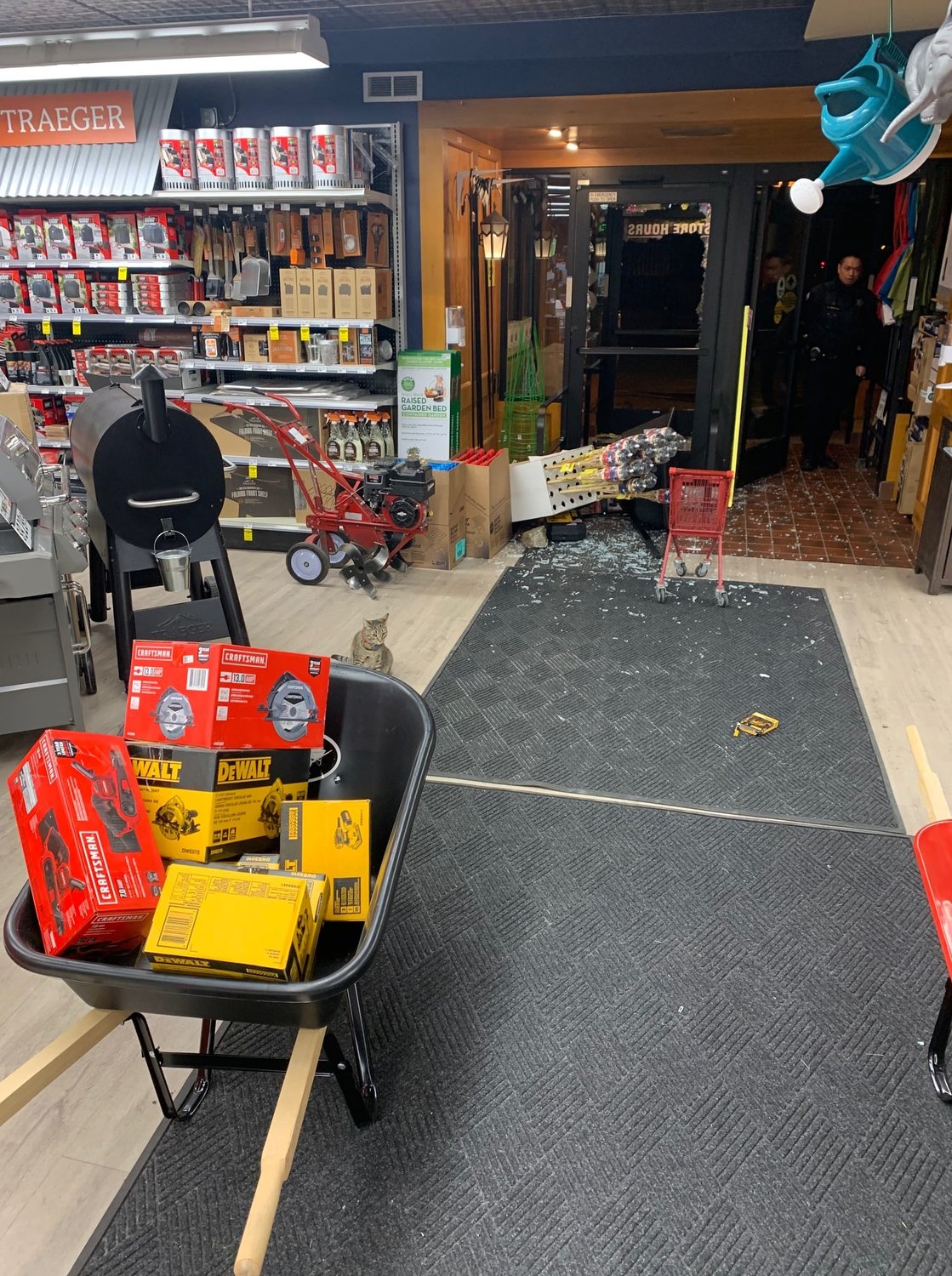 Officers make a report on the damage at Nicollet Hardware after a break-in in the early morning hours of Friday, April 22. Images of the burglars are posted on the business Facebook page.