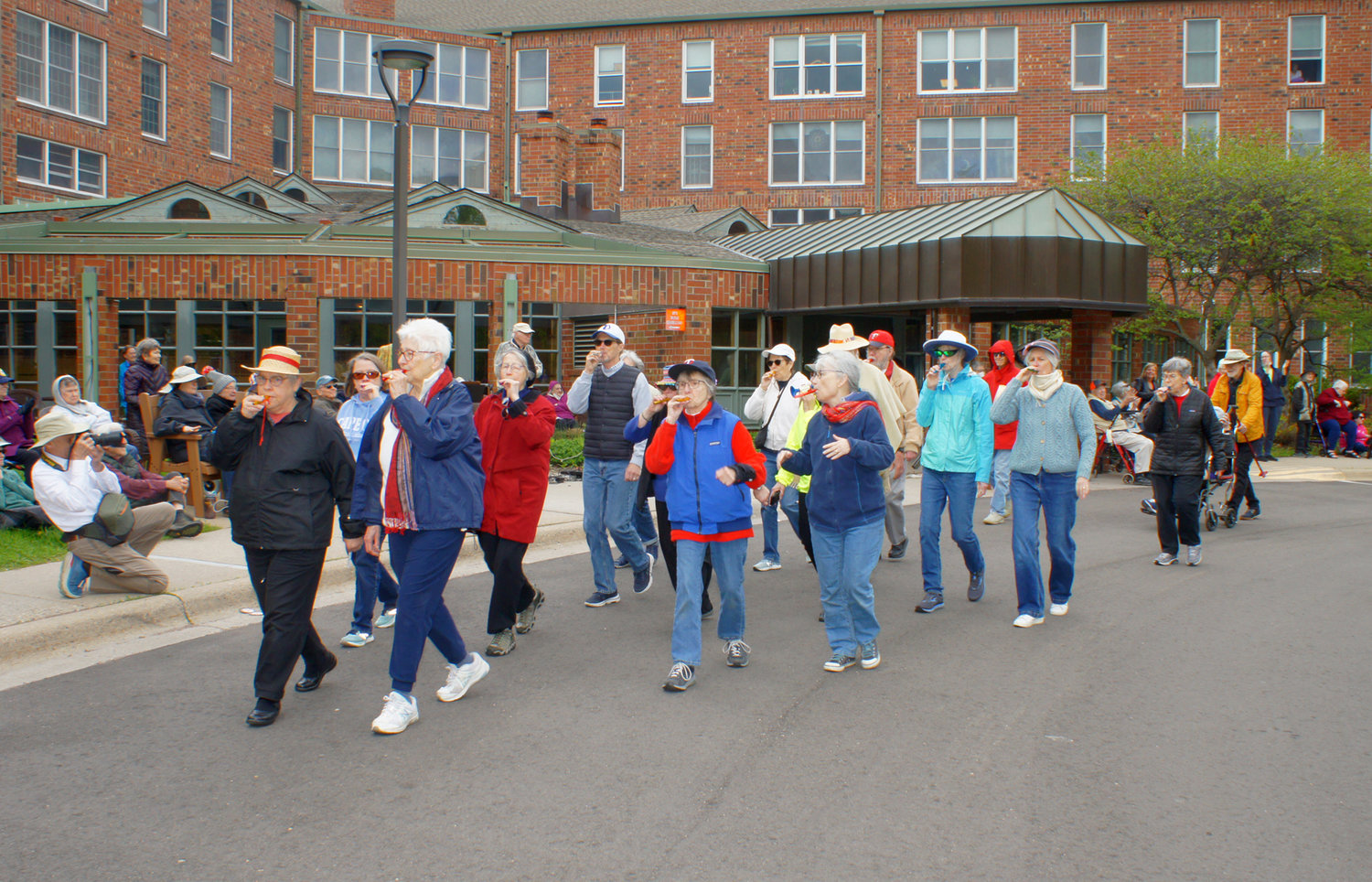 The kazoo band marches in front of Becketwood. AT RIGHT: Dancers (left to right) Anita Doyle, Vanji Bratt, Judy Bahn, and Carol Mockovak.