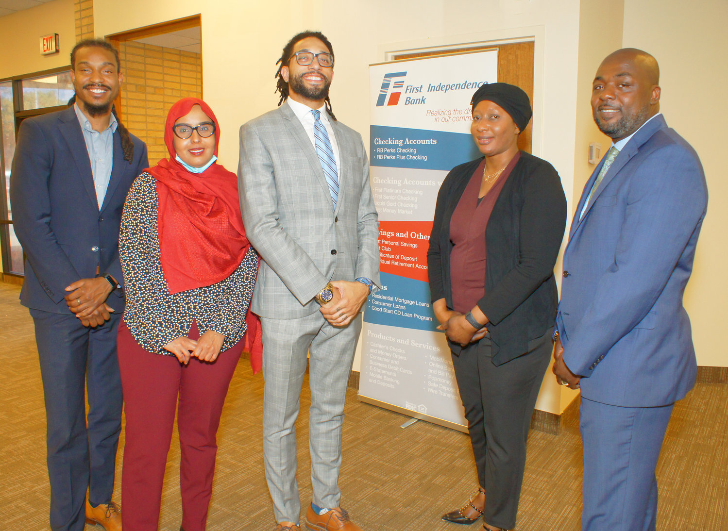First Independence Bank staff include (left to right) Vachel Hudson, Deqa Noor, Andrew Ndekwe, Auntymetta Colley, and Damon Jenkins. (Photo by Terry Faust)