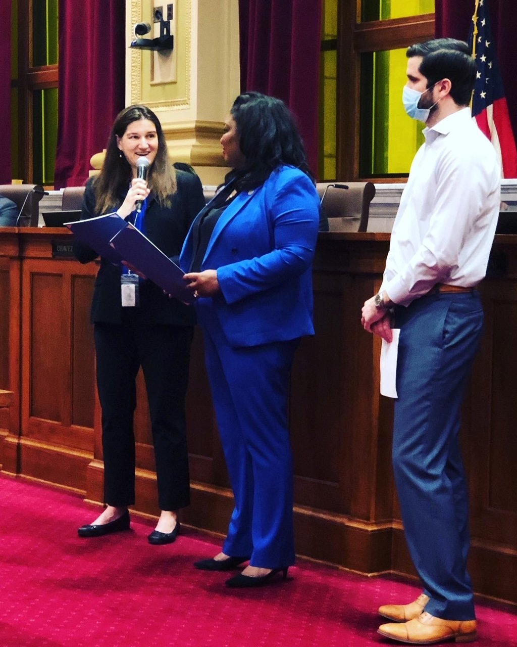Council members Linea Palmisano (left) and LaTrisha Vetaw, along with Billy Hanlon, present at the city council on May 12 regarding a resolution supporting Myalgic Encephalomyelitis/Chronic Fatigue Syndrome Awareness Day. (Photo submitted)