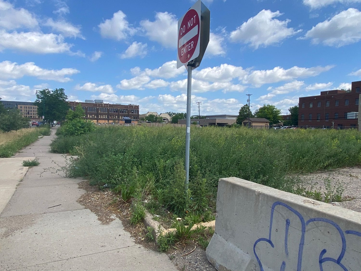 Two years ago, this block was nearly one continuous building. On the south was the Minnehaha Post Office, then MIGIZI, Gandhi Mahal, and the Odd Fellows building that housed many businesses, including Town Talk Diner and El Nuevo Rodeo nightclub. The block remains vacant. (Photo by Tesha M. Christensen)