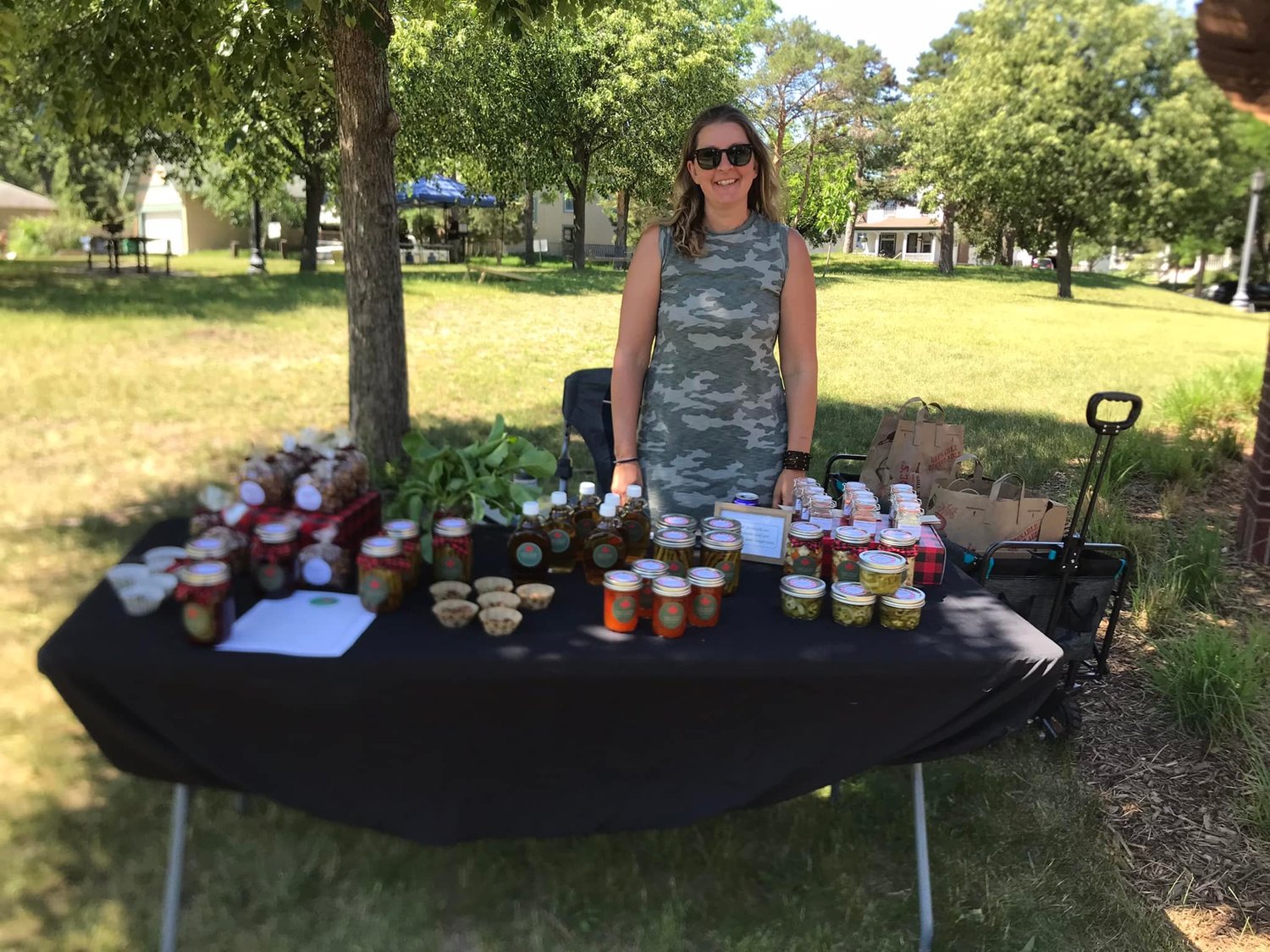Barb Koloshuk, the owner of Lake Seven Orchards, sells homemade pickled beets, pickled peppers, maple syrup and more at the first Twin Cities Community Pop-Up Market at Mueller Park on June 18.