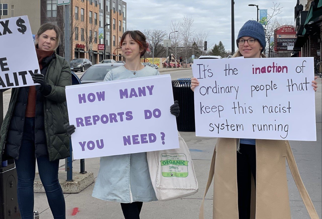 Kristen Ingle (left), Ray Klahr, and Elliana Lippold-Johnson participate in a protest against racist policies in southwest Minneapolis. (Photo submitted)
