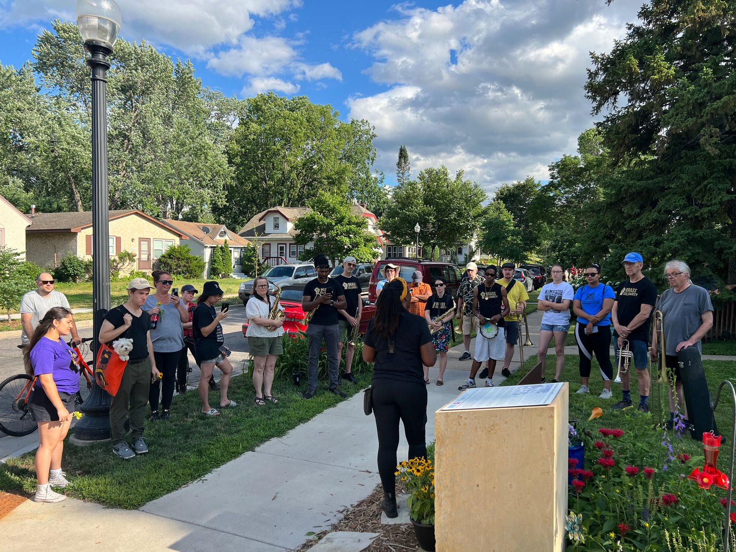 Marcia Howard shares the history of the Arthur and Edith Lee house at 4600 Columbus. She pointed out that the group assembled on July 11 was nothing like the angry white mob that gathered there in 1931. (Jill Boogren)