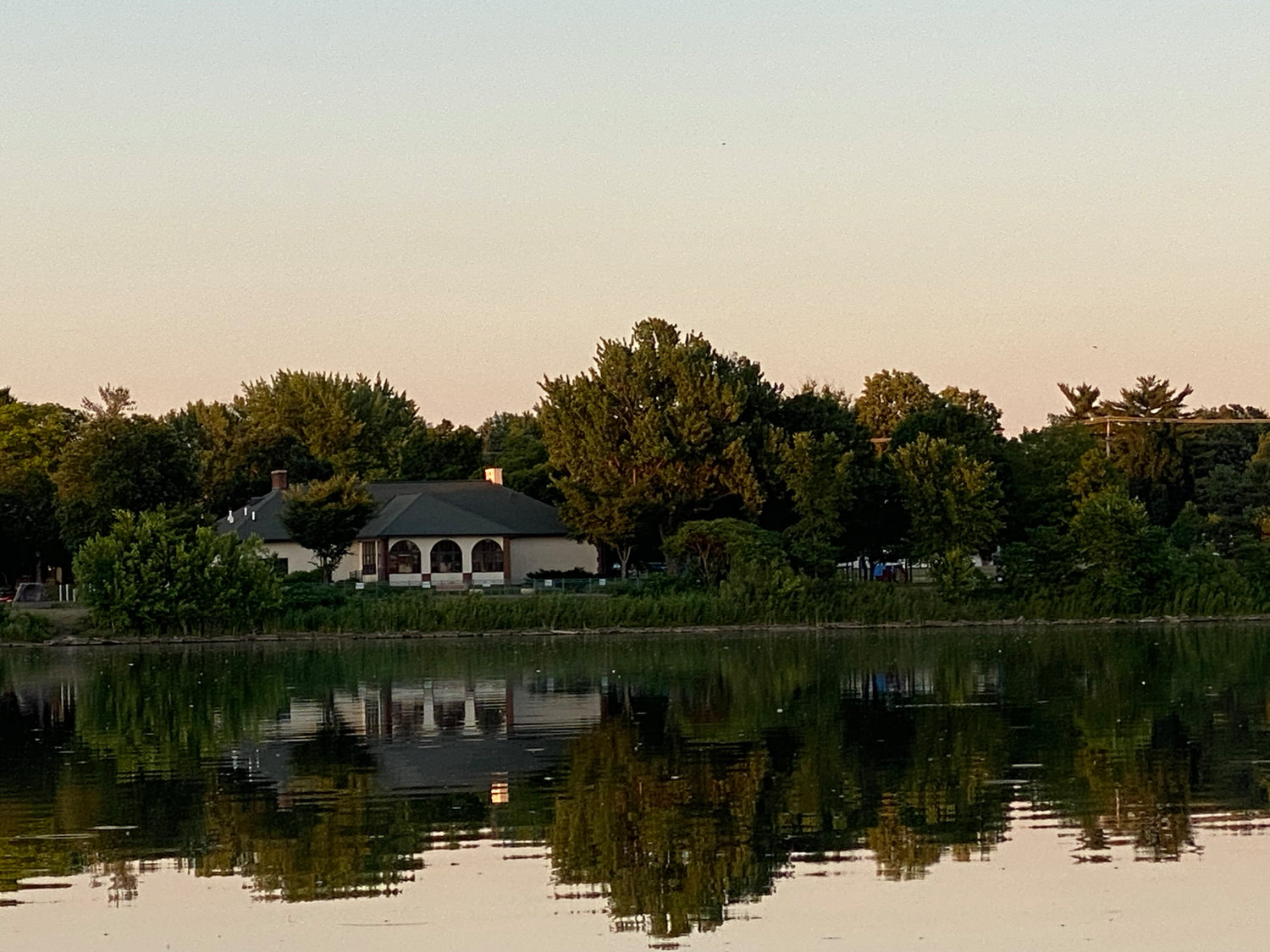 A view around Lake Hiawatha from a kayak, June 22, 2022. This is north, facing the Hiawatha Recreation Center and playground.