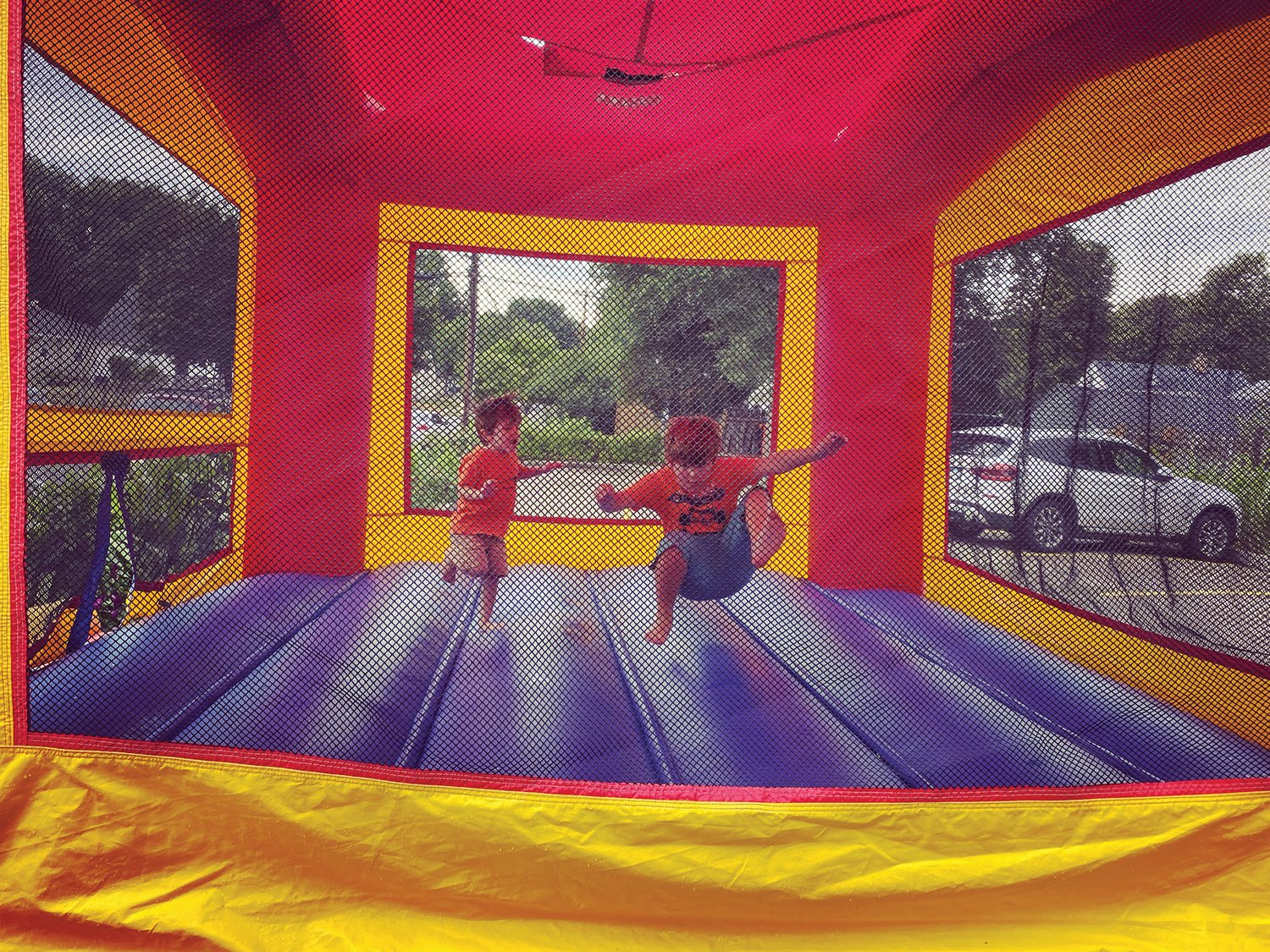 Harrison Bittner (left) enjoys the bounce house at GrandeSunrise with his brother, Aiden, 8, on his fourth birthday.