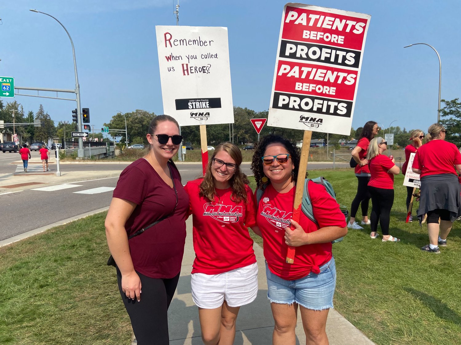 From left to right: Katie Dugan, Shawna Gebretsadik, and Carla Velez held signs on the picket line at M Health Fairview Hospital Southdale at 6401 France Ave S, Edina on Sept. 14th, 2022. "We're out here so it's better inside," Gebretsadik said.