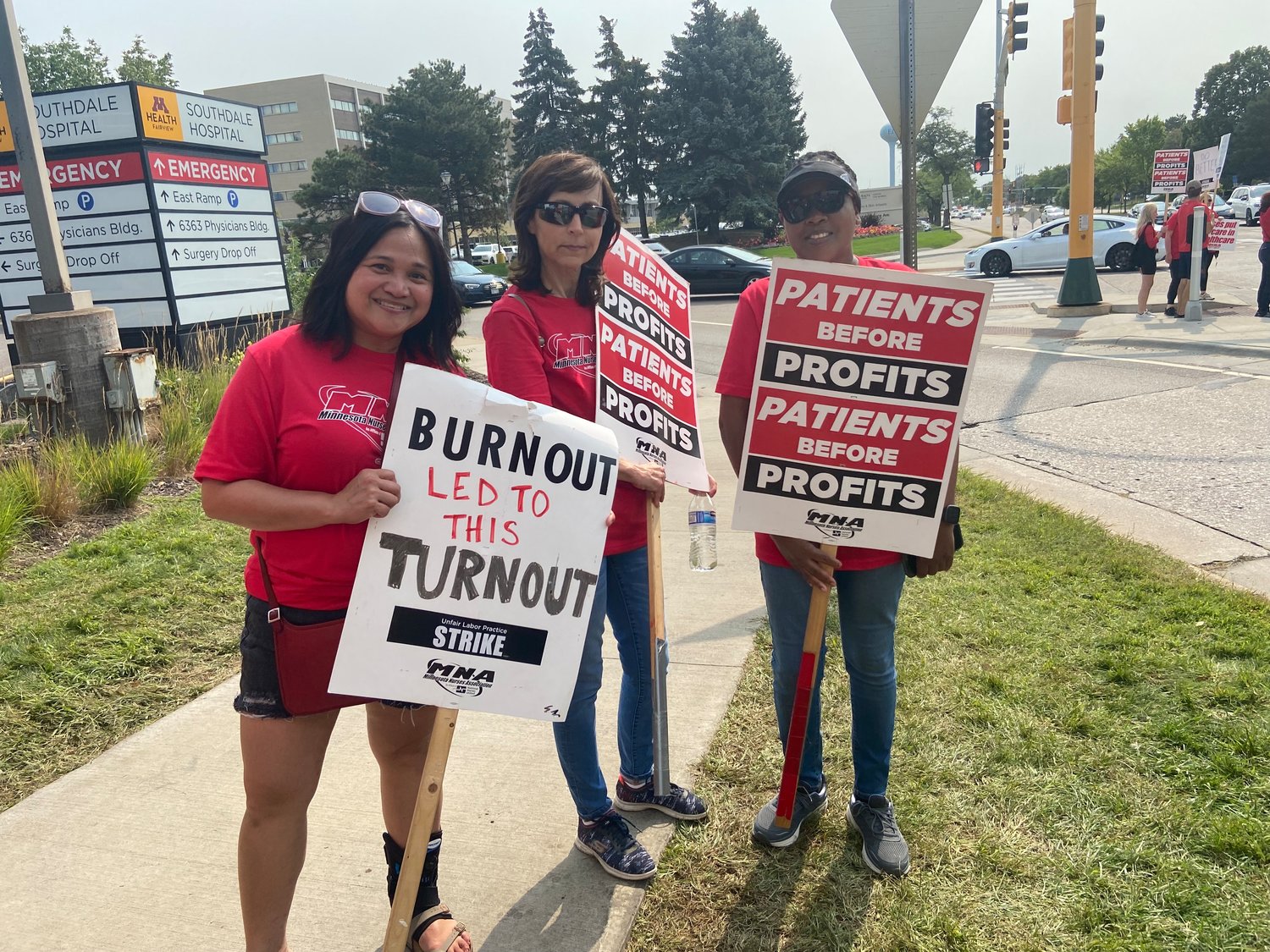 From left to right: Donna Soriano, Nellie Arsemyeva, and Diphina Sang gathered to strike in front of M Health Fairview Hospital Southdale, 6401 France Ave S, Edina on Sept. 14th, 2022. "We do not have appropriate staffing," Arsemyeva said. "We are expected to work doubles and may have 6 to 8 patients to care for at one time."