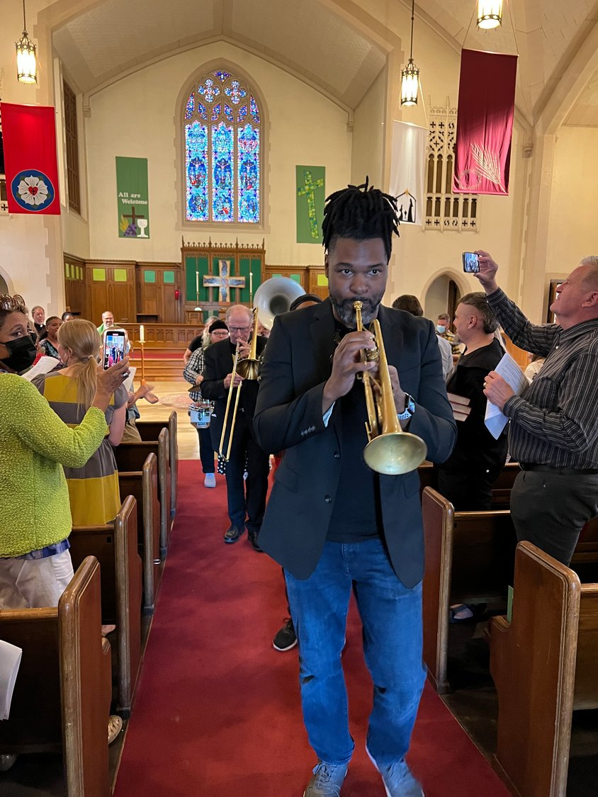 Members of Brass Solidarity lead a musical procession out of the Calvary sanctuary on Sept. 11.