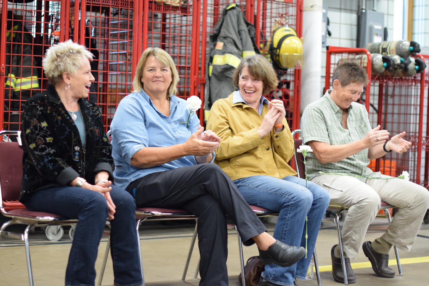 Vicki Hoff, Mary Mohn, Jean Kidd and Bonnie Bleskachek share laughs and stories as they are recognized on the 30th anniversary of their service as Minneapolis’ first all-women fire crew.