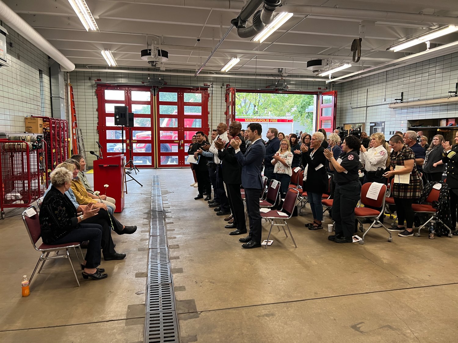 The four members of Minneapolis Fire Department’s first ever all-women crew receive a standing ovation at a Sept. 23, 2022, event commemorating the 30th anniversary of their time serving together.