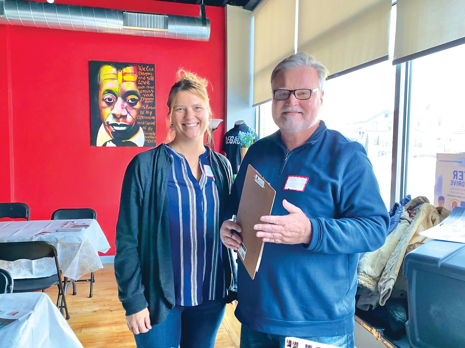 Tesha M. Christensen (left) and Denis Woulfe of the Longfellow Nokomis Messenger check in attendees at the Dec. 8 LBA luncheon at the Legacy Building as the LBA returns to in person events after a hiatus during the pandemic. Woulfe has been on the LBA board since 2019.
