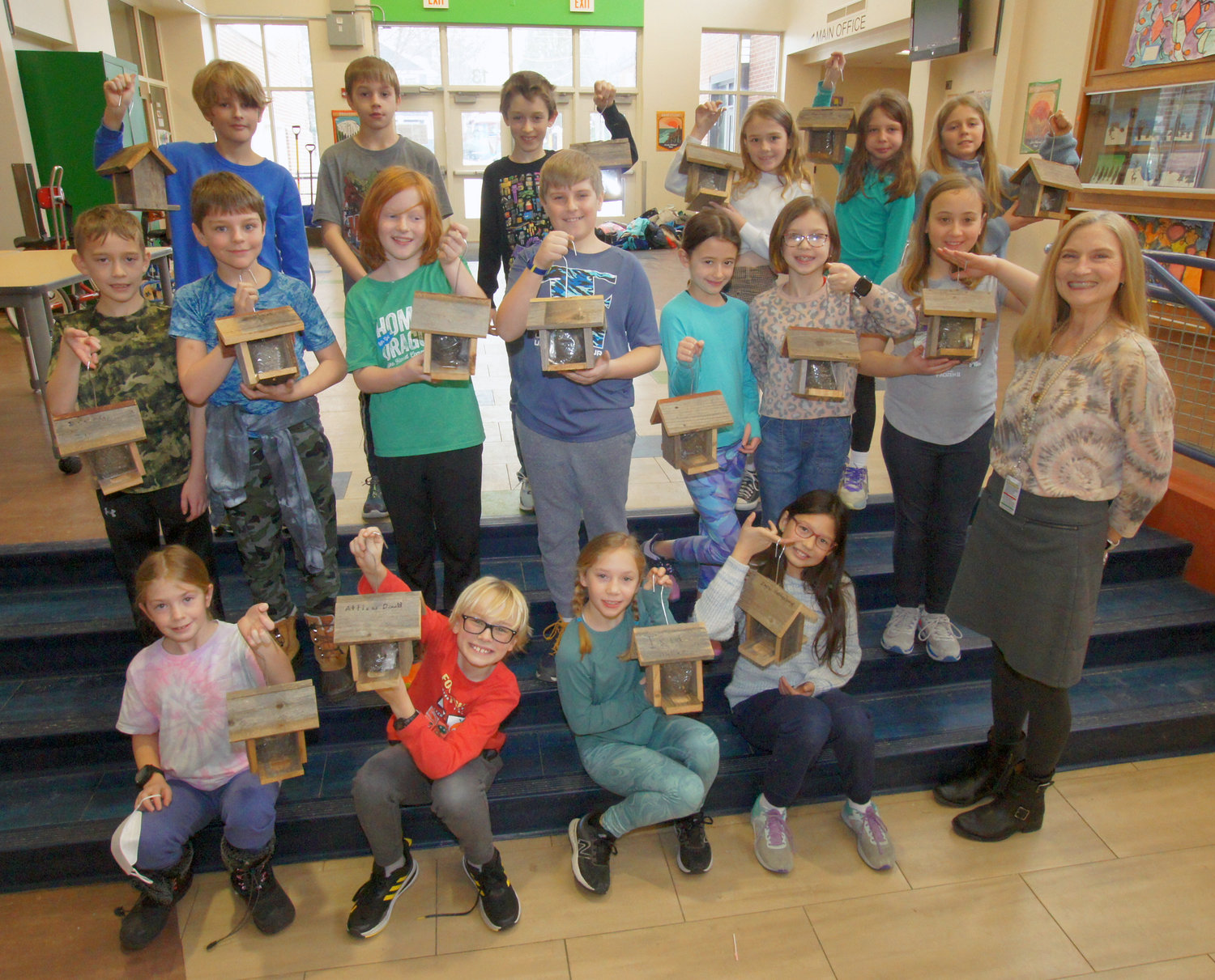 Amy O'Hara's 4th Grade Lake Harriet Community School class proudly posed with their complete birdfeeders. (Photo by Terry Faust)