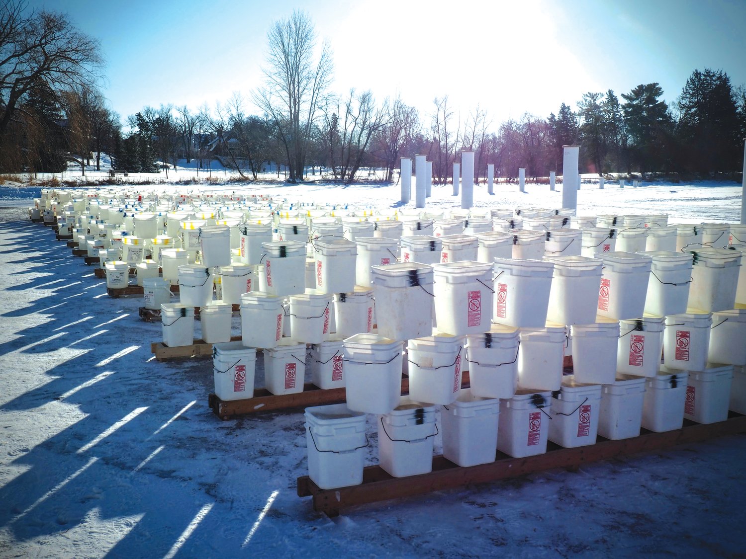 Volunteers fill buckets with ice from Lake of the Isles that will be used in the Luminary Loppet. (Photos submitted)