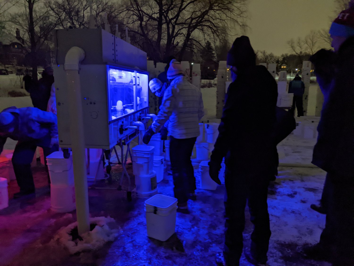 Volunteers fill buckets with ice from Lake of the Isles that will be used in the Luminary Loppet. (Photos submitted)