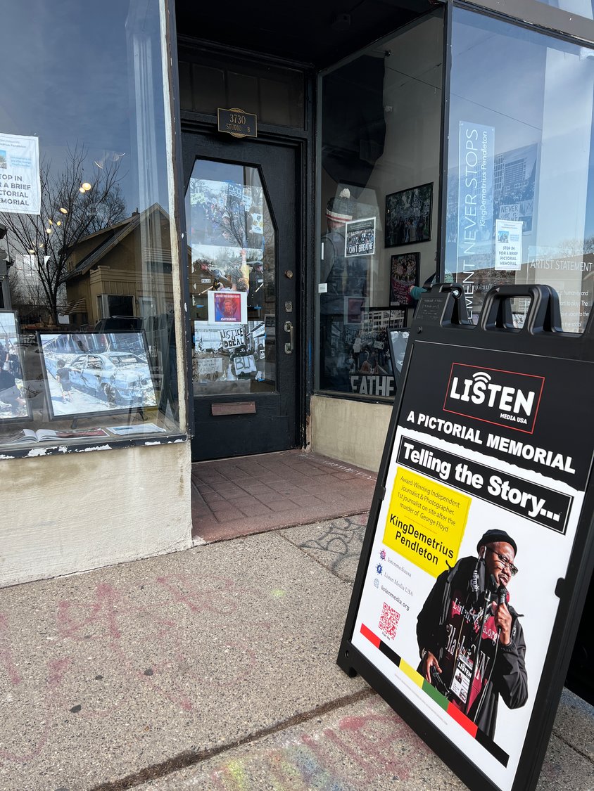A sandwich board outside The Third Place Gallery invites passersby to come in and see KingDemetrius Pendleton’s exhibition, “The Movement Never Stops.”