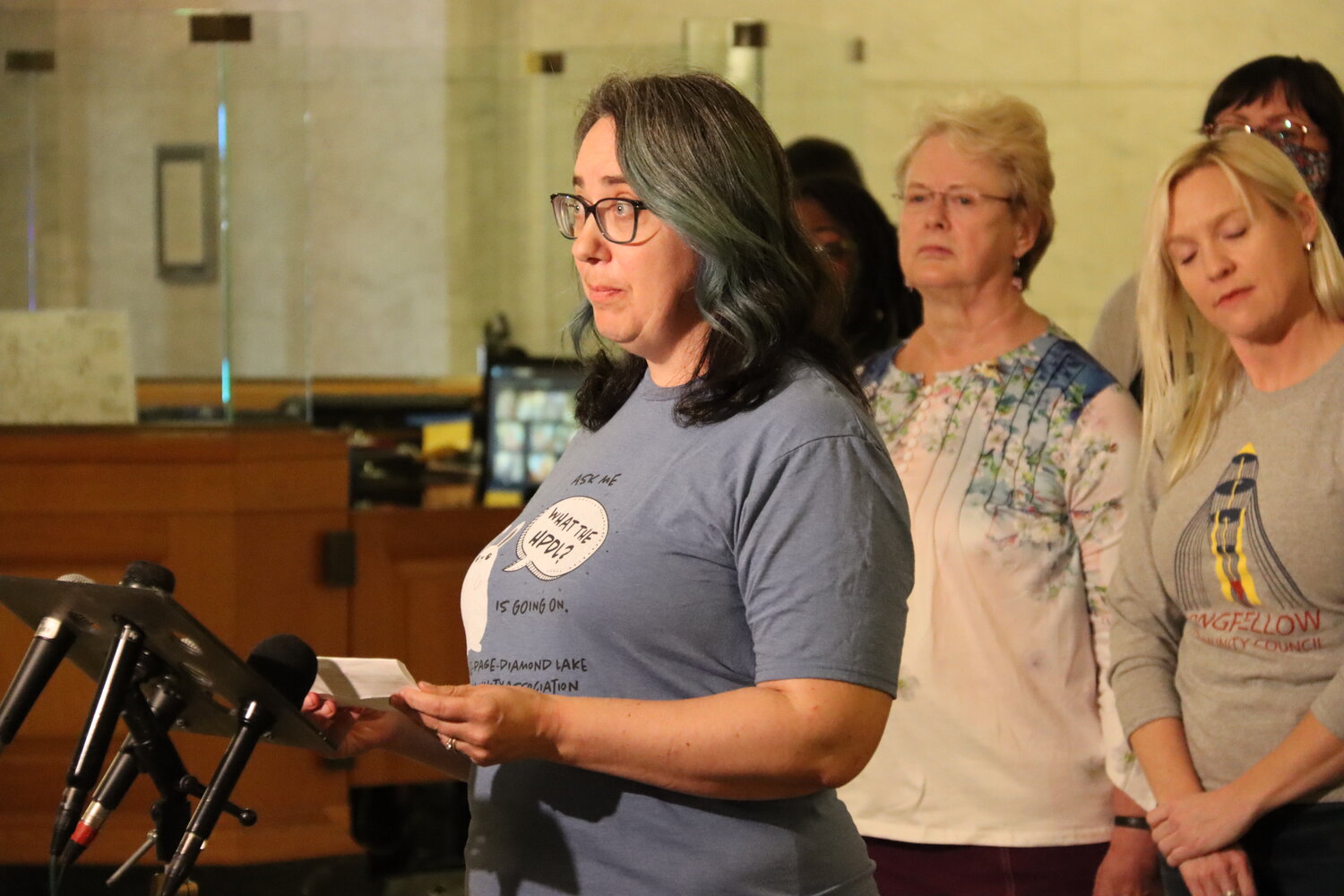 Ann Zawistoski of the Hale Page Diamond Lake Community Association stands in support of more community engagement during the Third Precinct press conference on May 16, 2023 at Minneapolis City Hall.