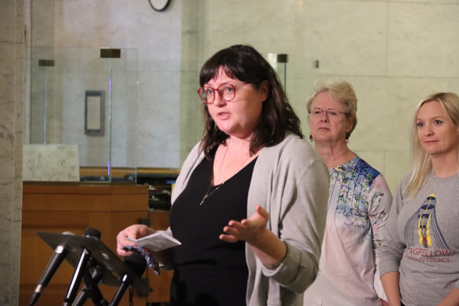 Standish-Ericsson Neighborhood Association staff member Kate Gens speaks at the Third Precinct press conference on May 16, 2023 at Minneapolis City Hall. "We want our residents and businesses voices to be heard," said Gens, pointing out that it will build trust and justice.