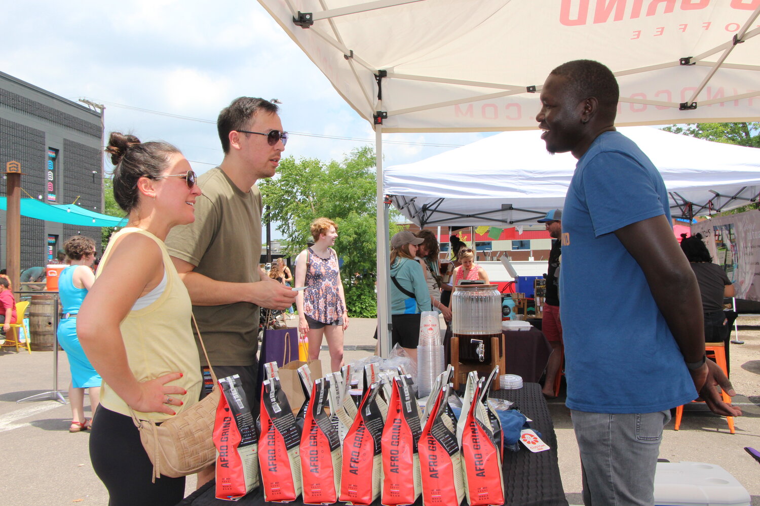 Omot Akway sells Afro Grind Coffee at the Soul of the Southside festival on Monday, June 19.