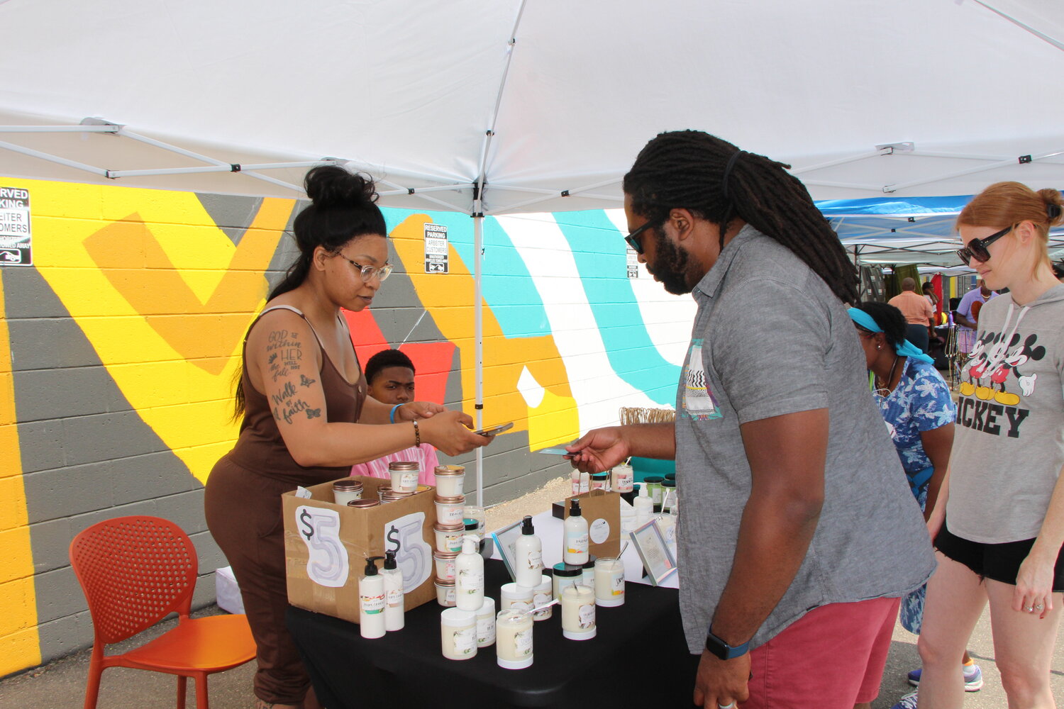 Dipp’d In Hunnie vendors sell body care products at the Soul of the Southside event on Monday, June 19.