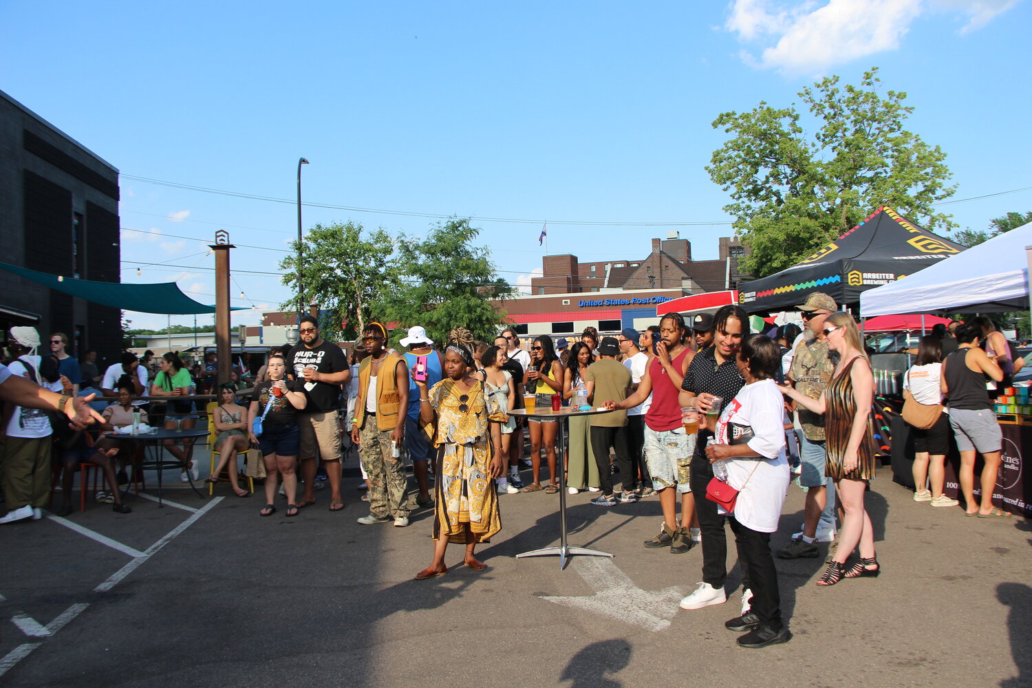 A crowd gathers around artists performing at the KRSM 98.9 booth at Soul of the Southside festival on Monday, June 19.