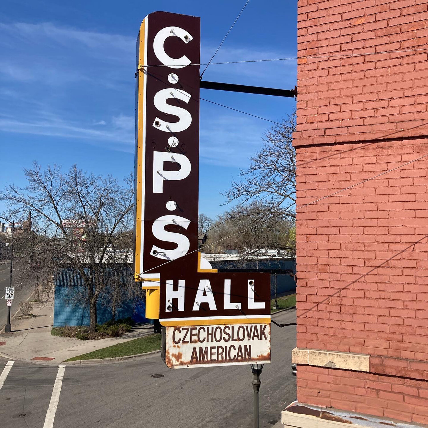 Signs around town that Forrest Wozniak has painted include CSPS Hall in Northeast Minneapolis, Hayes Window Restoration in Longfellow, and Hope Breakfast Bar in St. Paul. (Photos submitted)