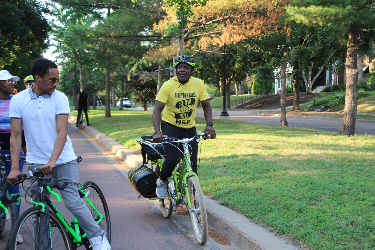 Anthony Taylor and Slow Roll members ride around South Minneapolis during the Hotter than July Southside Late Solstice Roll on Thursday, June 29.