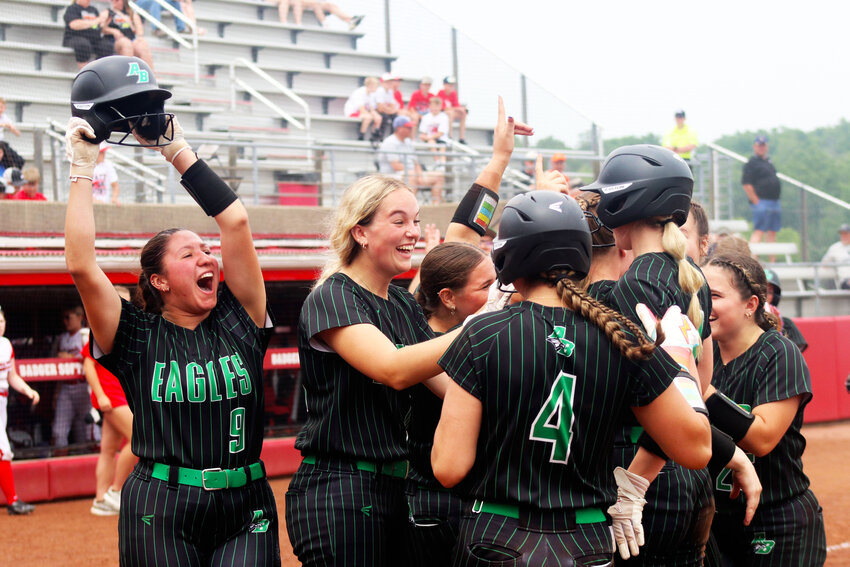 The Almond-Bancroft Lady Eagles celebrate their 18-3 finish over Thorp in the State semi-final on June 12. This win advanced them to the State finals on June 14.