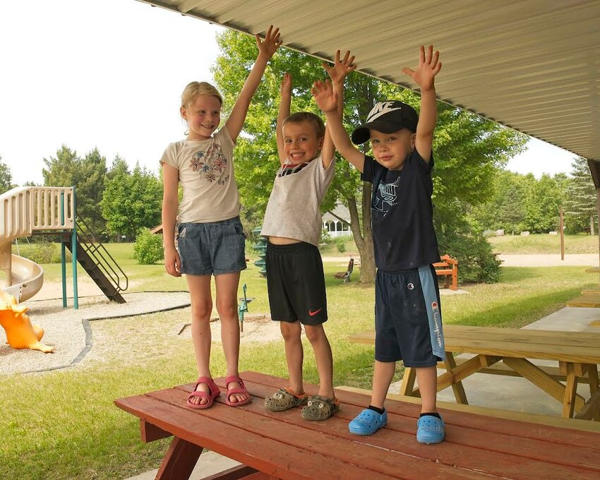 Sadi, Micah and Kane were excited to try and reach the new ceiling in what is called the Bingo section. Playground For Tomorrow funds were not used for pavilion improvements; however, the Park Board is continuing fundraising efforts including Bingo this fall along with grant applications and other activities. The 20 new picnic tables were funded through the Township of Coloma just in time for Chicken Chew.