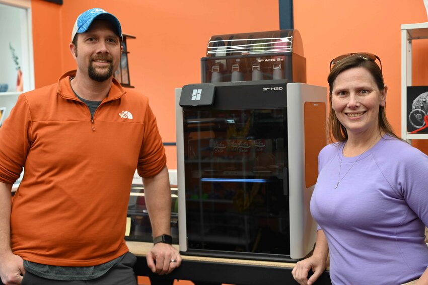 Mike and Amanda Ryszkiewicz have just opened Lux Layers in downtown Waupaca as a full service 3D printing shop. Inside this printer they are creating replica cola bottles from the game Fallout. 
Emily Doud Photo