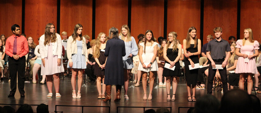 Donna Arendt presents scholarships to some of the 200 recipients of the awards managed by Incourage Community Foundation. Contributed photo