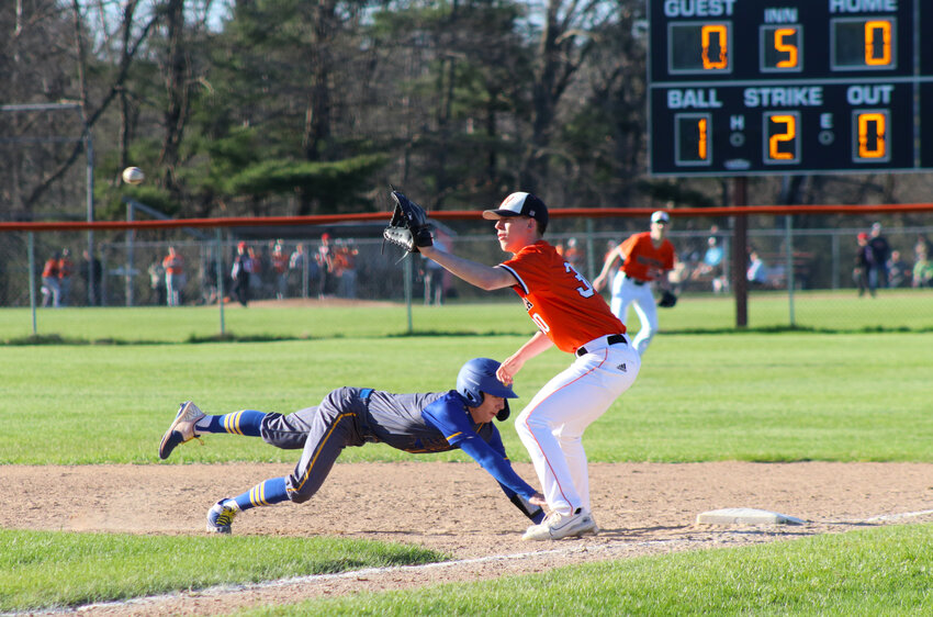 Senior Hornet Taylor Krueger gets ready to catch the ball for a chance to tag out a Mauston runner on first base.