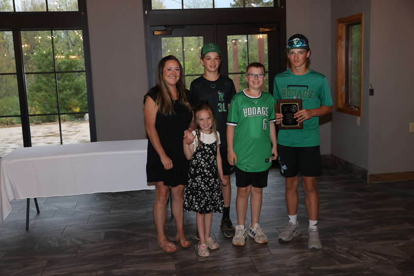 The Bauer family, Jenna, Avery, Eli, Isaac and Blake, accepted the Heart of the Hodag Award on behalf of Dan who passed away in November 2024.