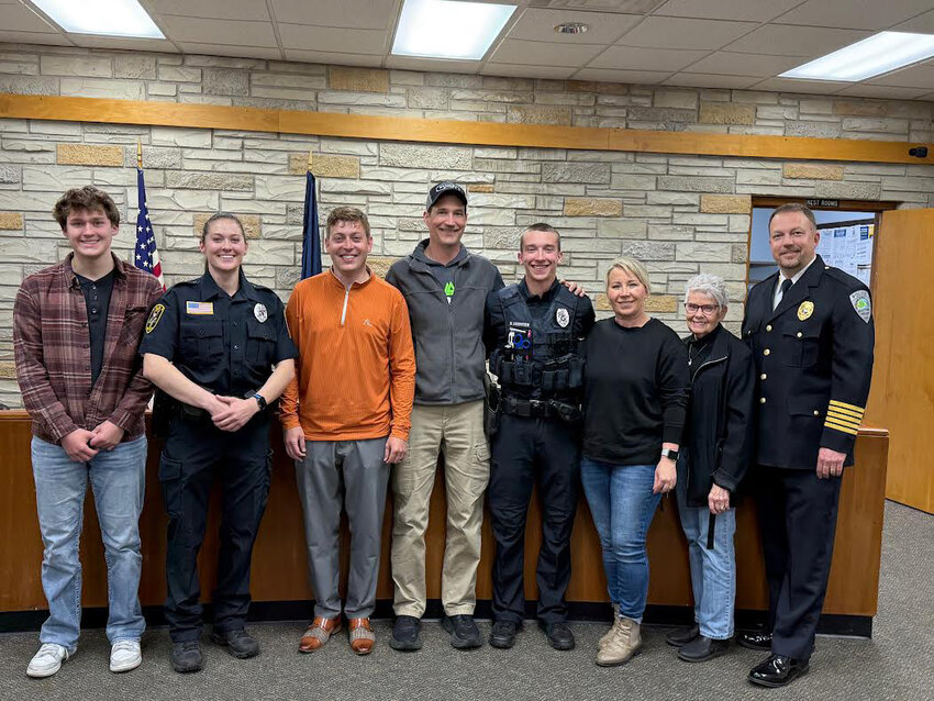 Brayden Gay, Officer Dani Jo Burns, Adminstrator Tommy Bohler, Tom Lauritzen, Officer Hayden Lauritzen, Tanya Lauritzen,  Chris Lauritzen, and Chief Paul Mott gathered for a photo following the swearing in of Officers Burns and Lauritzen on May 21st.