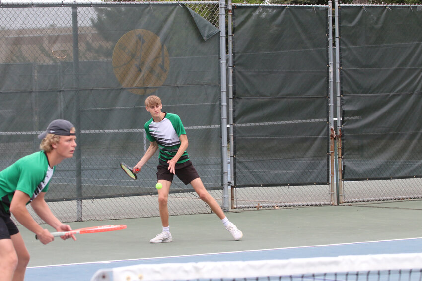 Rhinelander's Michael Schiek returns a volley as partner Aiden Ostermann waits for a return.