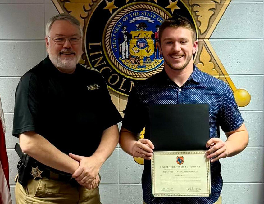 Pictured are Klug and Lincoln County Sheriff Ken Schneider.