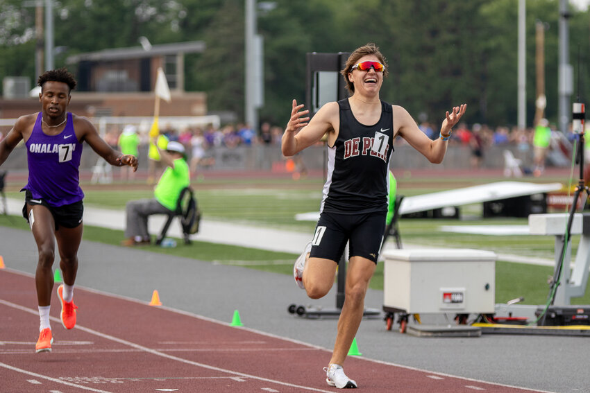 Grady Lenn crosses the line full of emotion with a new state secord in the 1600M run.