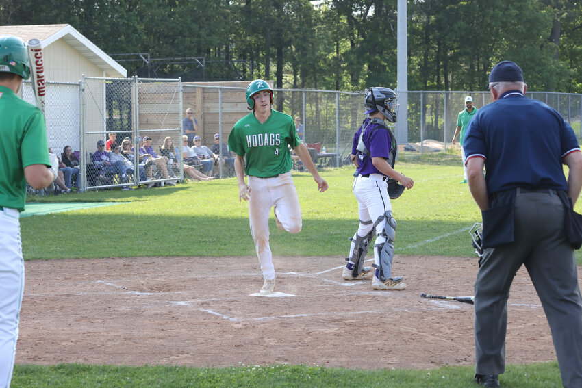 Senior John Turek scores on a Dylan Vanderbunt single.