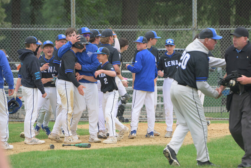 This was the scene at home plate after Ty Shallow came across int he bottom of the seventh inning to break a 3-3 tie with the Cavaliers and hand the Wildcats a win in the opening round of sectional play on Tuesday in Plover.
