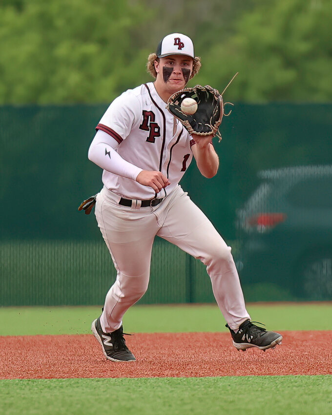 Lucus Koskey fields the ball for the Redbirds in sectional action against Hortonville.