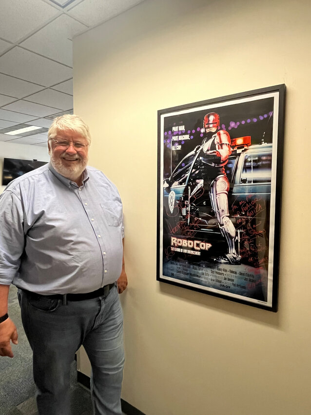 Mayor Mike Wiza with a RoboCop poster signed by Peter Weller. Of the poster, he said, “One April, Peter Weller was at a ComicCon event in Chicago. I couldn’t go, so I sent a friend of mine. She told him the story, and in the end, I got a signed, personalized movie poster from Peter Weller that even lists his old address in Stevens Point on it. He said he wanted a picture back of it, because he said ‘I want to see it hanging in the mayor’s office.’”