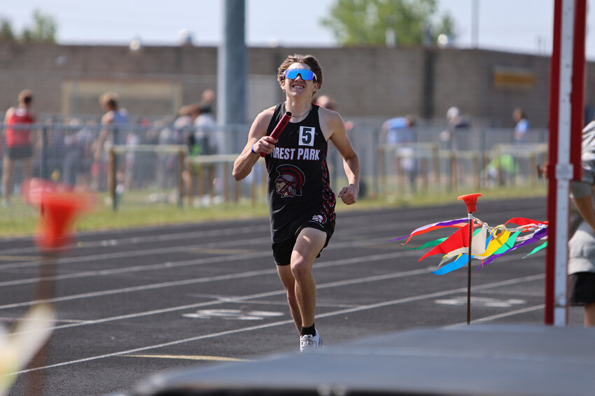 Forest Park Max Mainvelle pushing his way down the track during the relay race taking second place.
