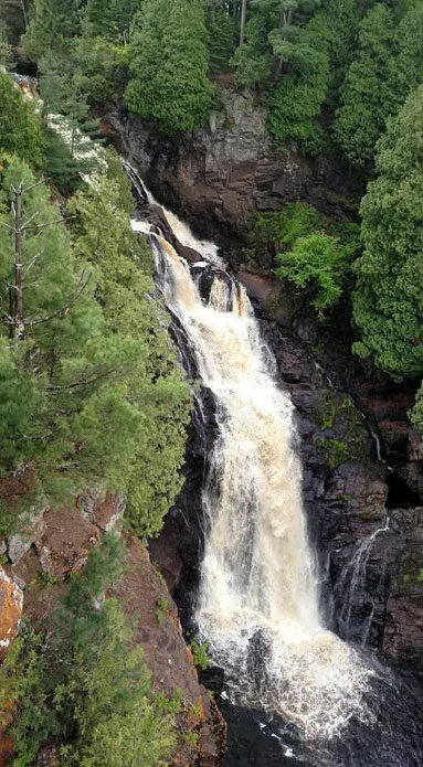 Bond's Falls, located 40 miles from Eagle River in Upper Michigan, has a staircase next to it that allows you to get up close and personal (and a little wet!).