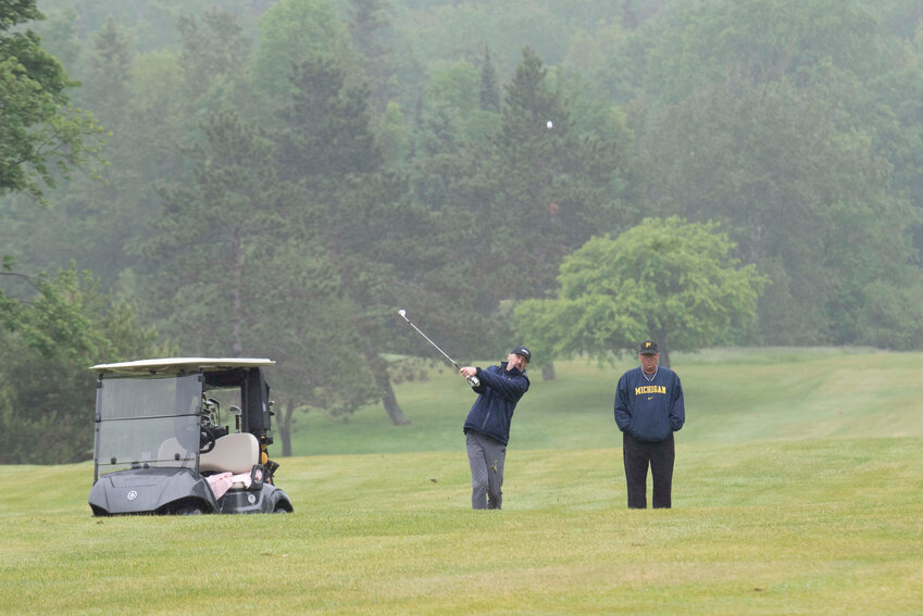 Toby Brzoznowski and Dan Schive achieve a masterful shot from the fairway.
