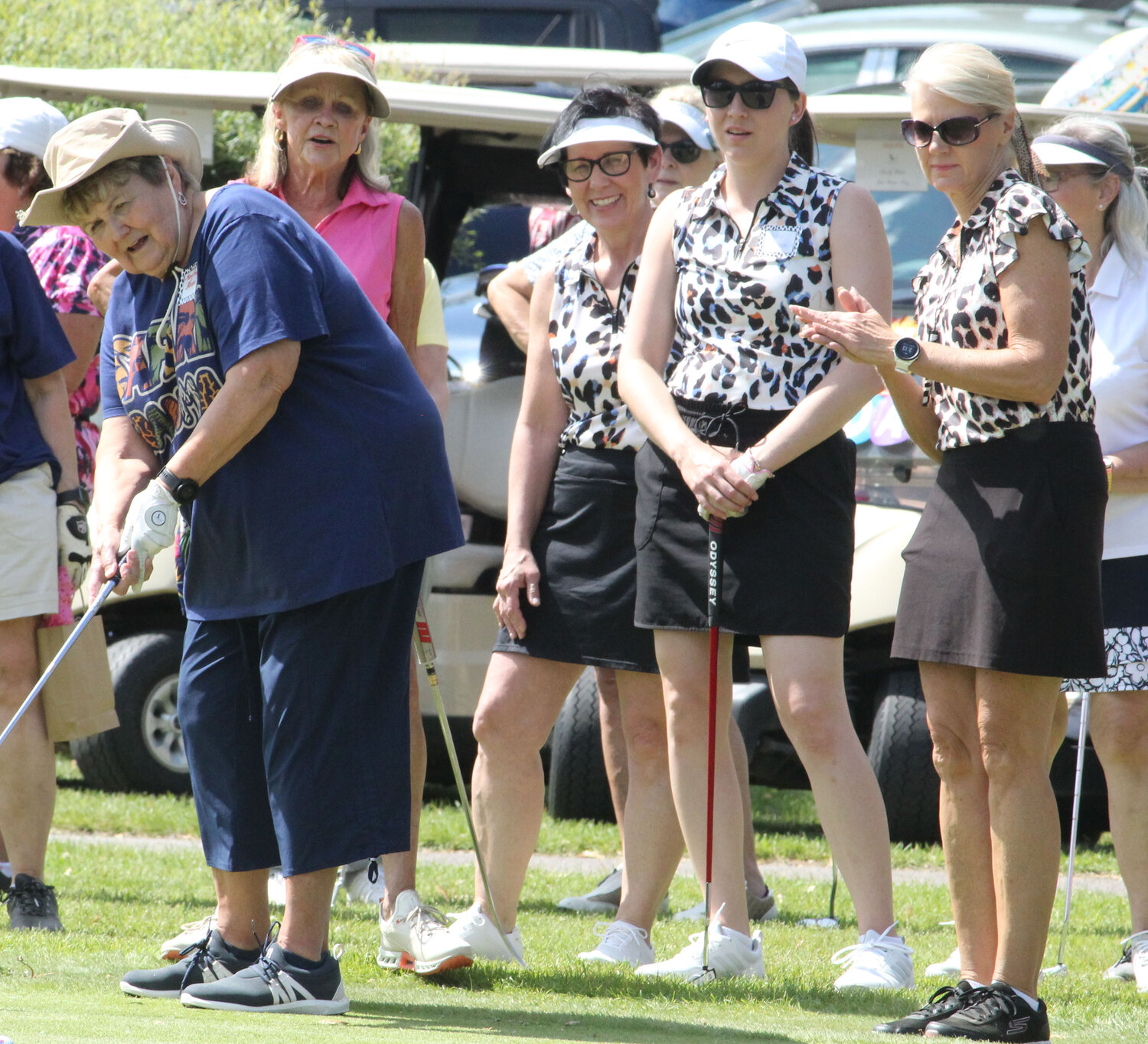 Mary Ann Hansen, left, who is the longest active Eagle River Ladies Golf League member (53 years), putts for her chance to hit a gift bag on the green to kick off festivites last Tuesday before a member-guest scramble that hosted roughly 100 golfers.