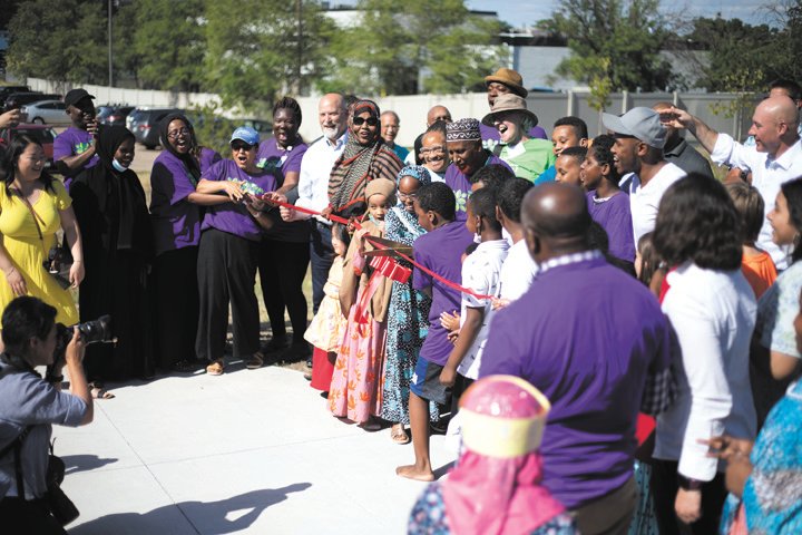 Community members officially cut the ribbon to open Midway Peace Park on June 15, 2021.