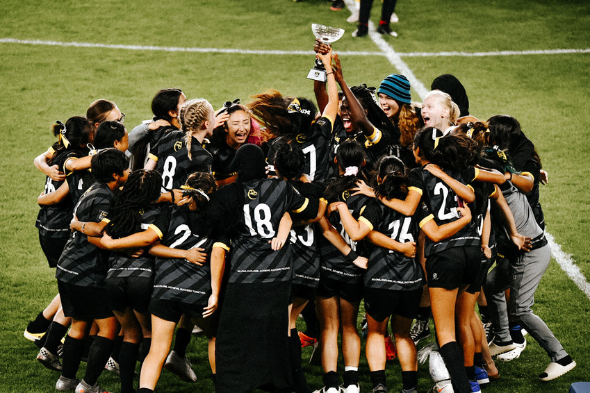 The Como girls soccer team celebrating with the Mayor&rsquo;s Cup after receiving it from St. Paul Mayor Melvin Carter on Friday, Oct. 8, 2021. (Photo by Wil Galvez)