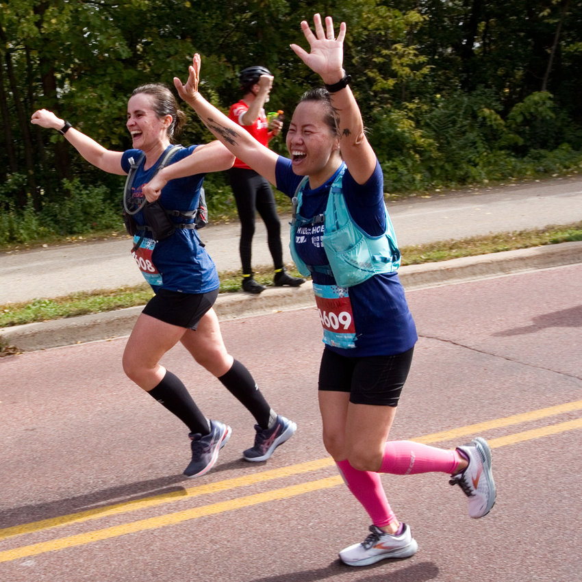 A pair of MiMS runners compete in the full 26.2-mile Twin Cities marathon on Oct. 3. (Photo by Margie O&rsquo;Loughlin)