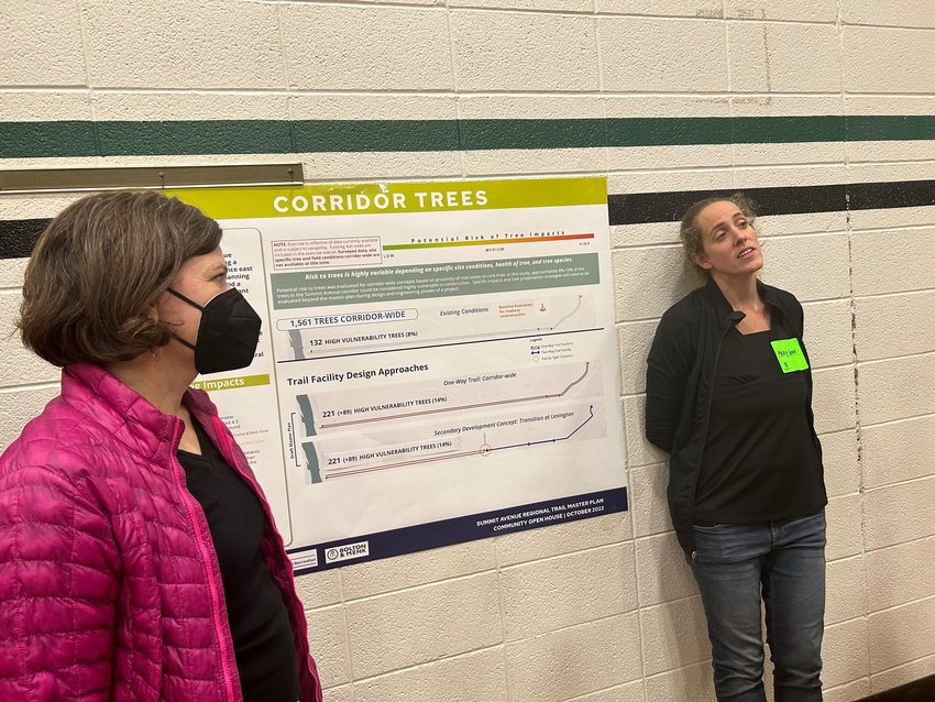 City Landscape Architect Mary Norton (at right) explains the city&rsquo;s findings about tree loss that would happen when constructing the bike lanes. The city is working with the Forestry Department of St. Paul and will continue throughout the process. (Photo by Chloe Peter)