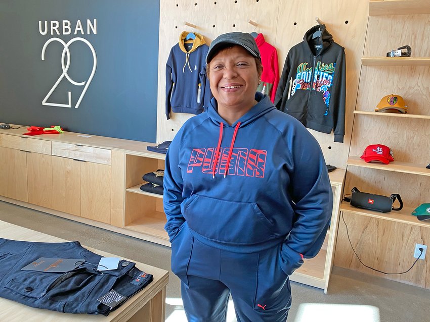 Urban29 owner Joyce Sanders stands in her new store at 633 University Ave. W., in the new Frogtown Crossing building. (Photo by Tesha M. Christensen)